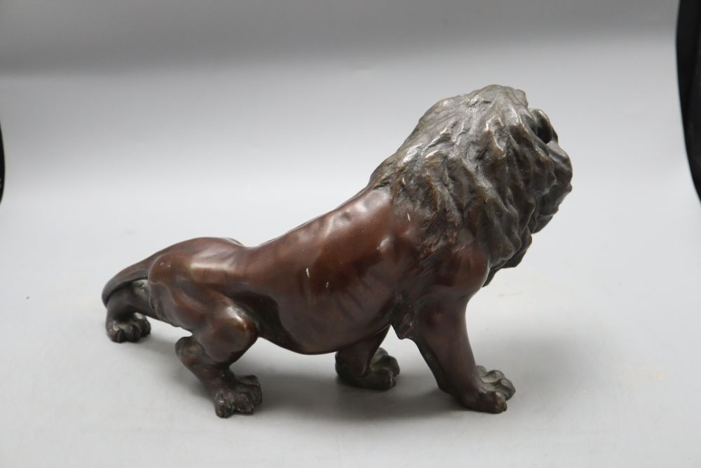 A Japanese bronze lion, length 35cm